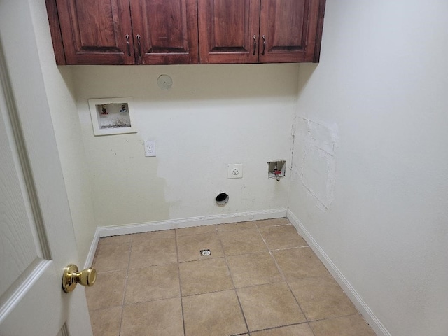 laundry room featuring washer hookup, cabinets, gas dryer hookup, and hookup for an electric dryer