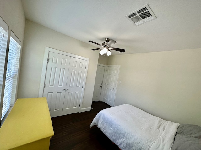 bedroom featuring ceiling fan and dark hardwood / wood-style floors