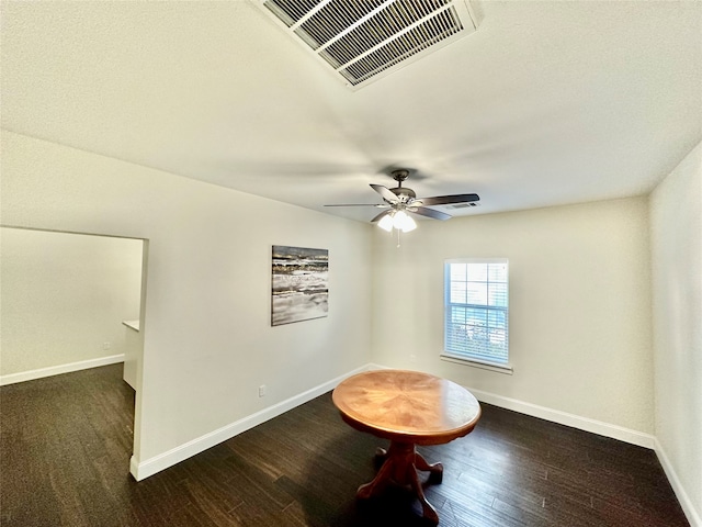 interior space with dark hardwood / wood-style floors and ceiling fan