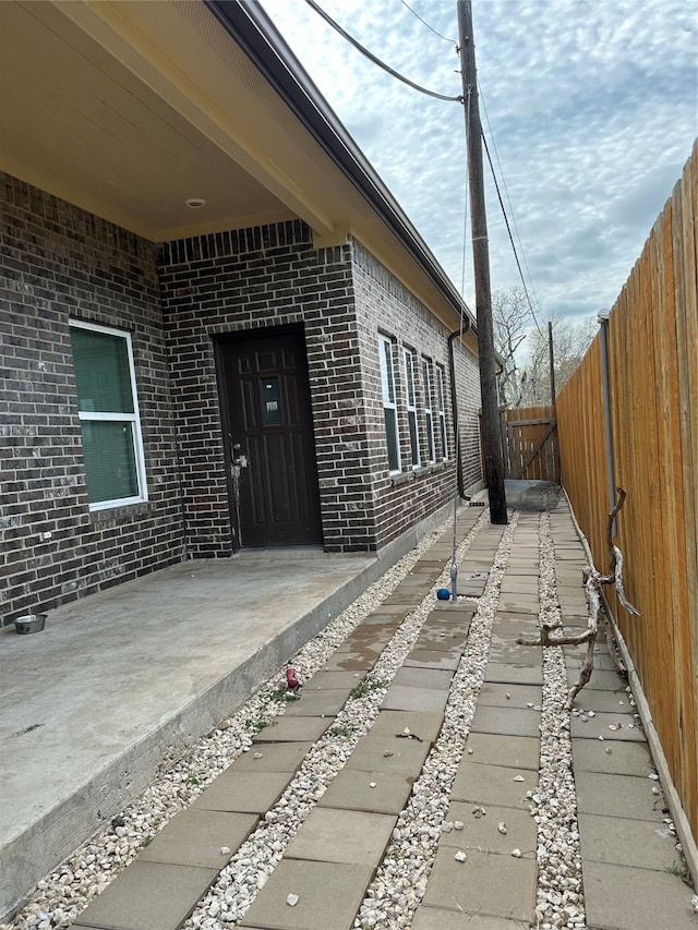 entrance to property featuring a patio