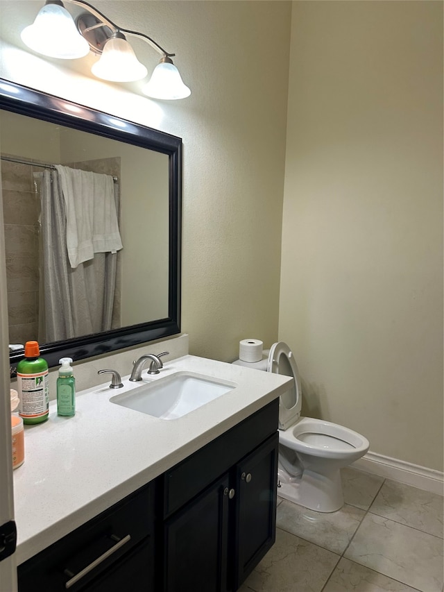 bathroom featuring vanity, toilet, and a shower with shower curtain