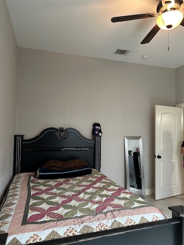 bedroom featuring ceiling fan and light tile patterned flooring