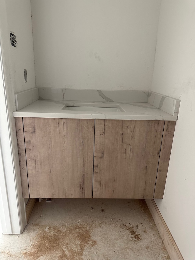 bathroom featuring concrete floors