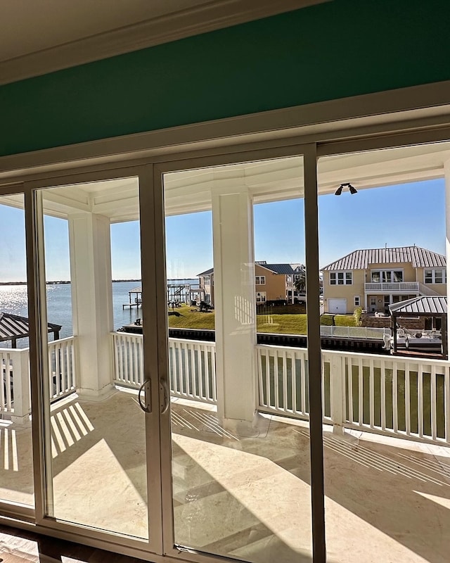 interior space featuring plenty of natural light and a water view