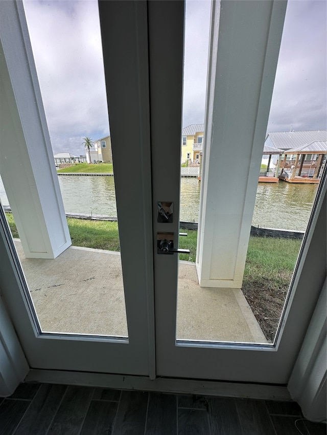 entryway featuring a water view and plenty of natural light