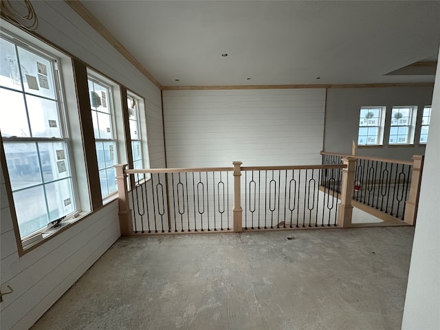 empty room featuring crown molding