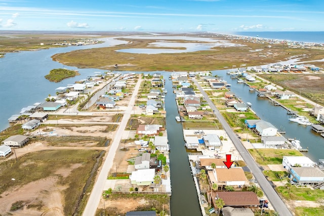 bird's eye view featuring a water view and a residential view