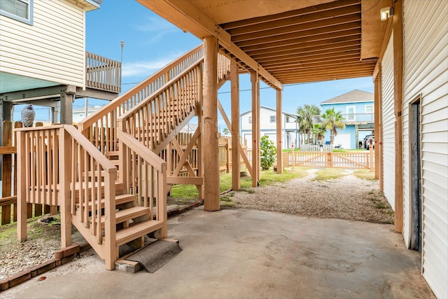 view of patio / terrace with fence and stairway