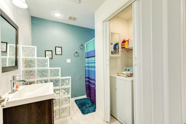 bathroom with tile patterned floors, vanity, visible vents, a shower with curtain, and washer / clothes dryer