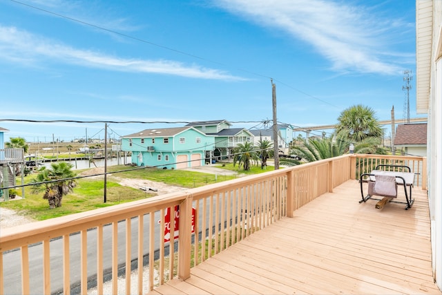 wooden terrace featuring a water view