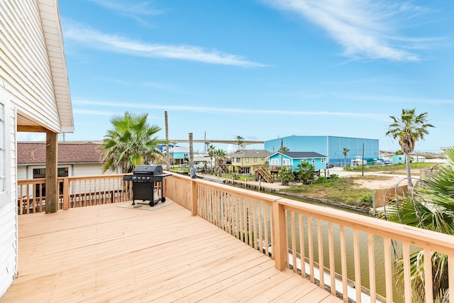 wooden terrace with a grill