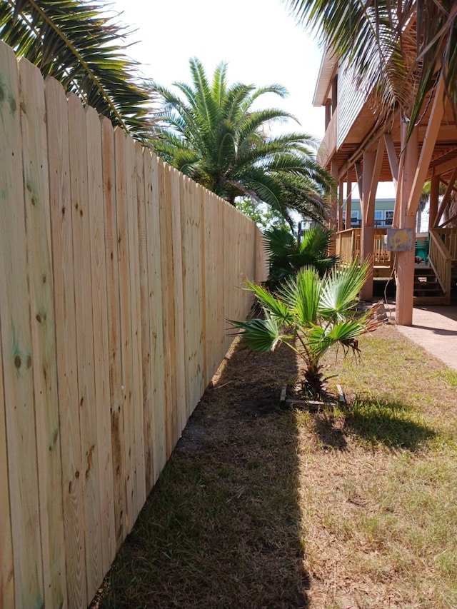 view of yard featuring a deck and fence