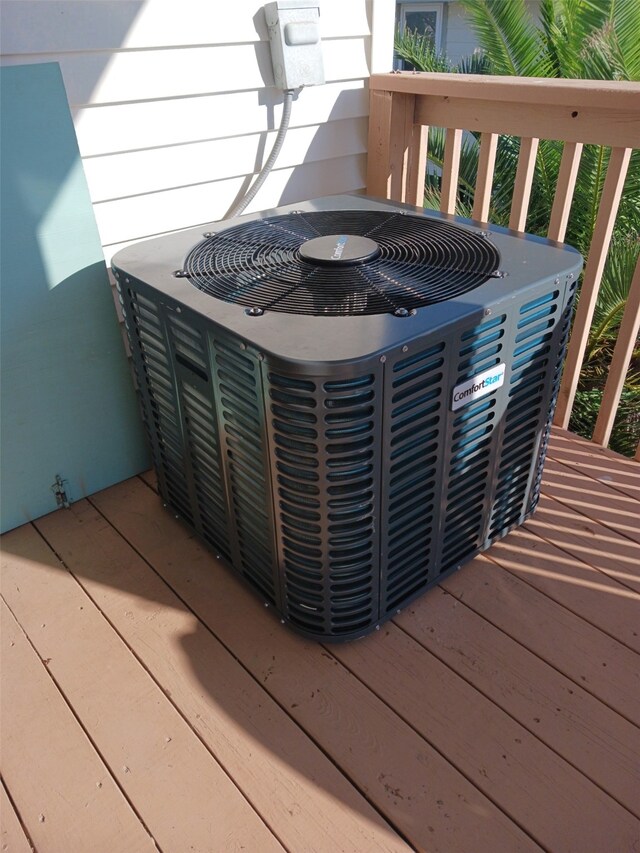 exterior details with a jacuzzi and central AC unit