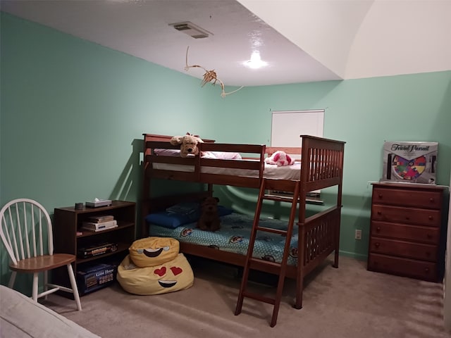 bedroom with light colored carpet and visible vents