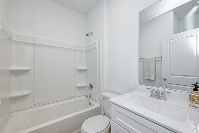 full bathroom featuring washtub / shower combination, vanity, and toilet