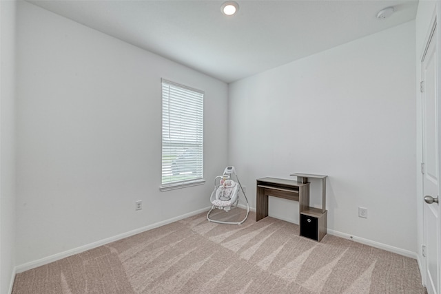 empty room featuring light carpet