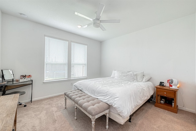 bedroom featuring ceiling fan and light colored carpet