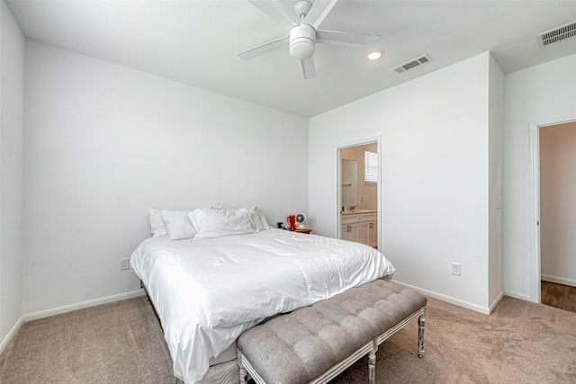 carpeted bedroom with ceiling fan and ensuite bathroom