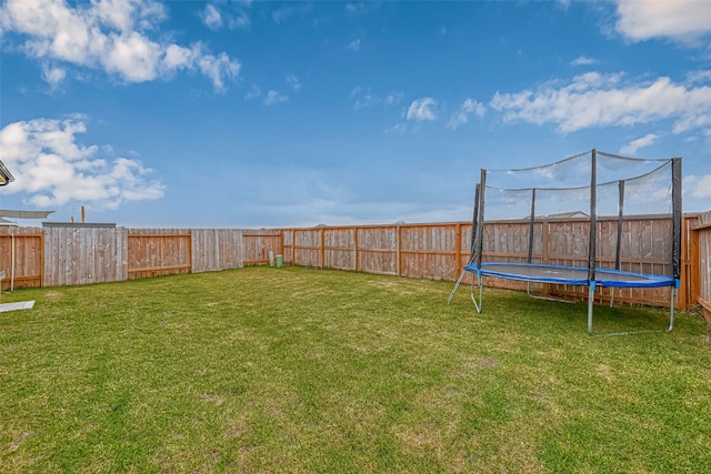 view of yard featuring a trampoline