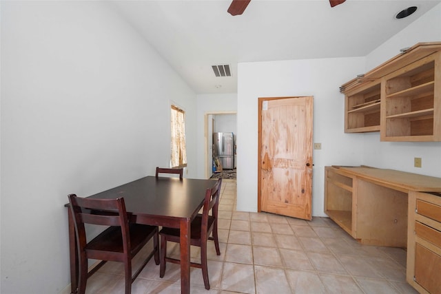 tiled dining room with ceiling fan