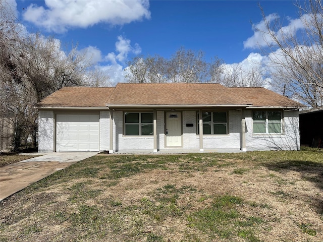 ranch-style house featuring covered porch, a garage, and a front lawn