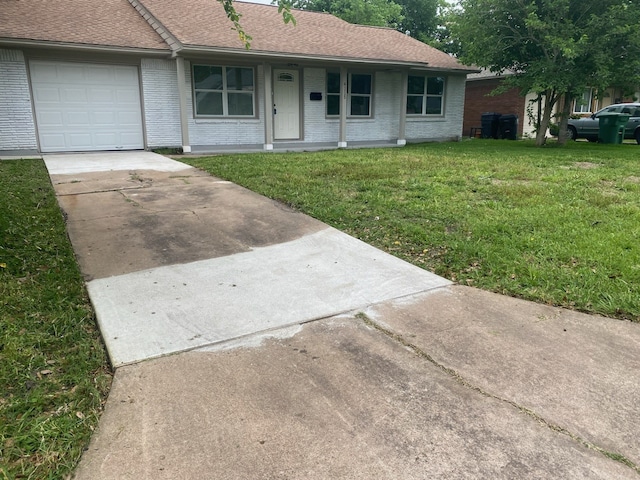 ranch-style home with covered porch, a garage, and a front lawn