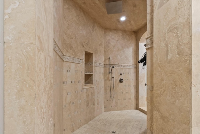 bathroom with a tile shower