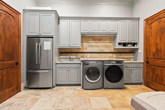 laundry room featuring sink and independent washer and dryer