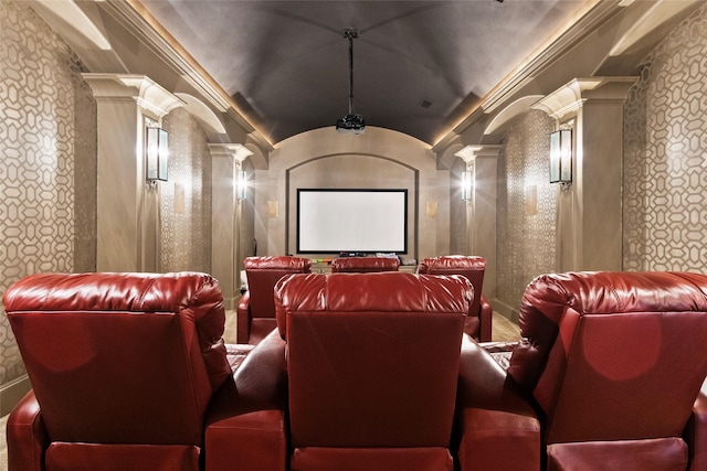 home theater room with decorative columns and ornamental molding