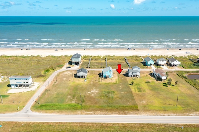 bird's eye view with a beach view and a water view