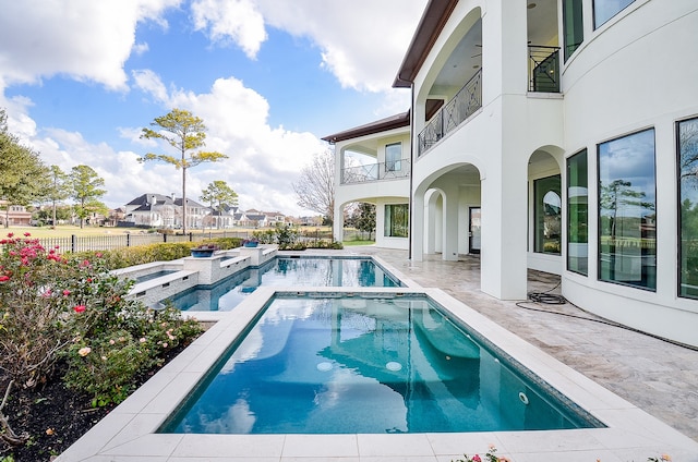 view of pool featuring a patio area