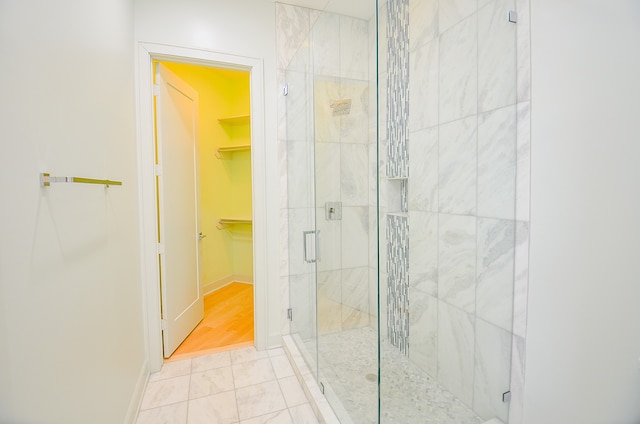 bathroom with tile floors and an enclosed shower