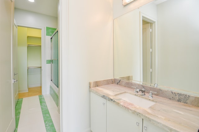 bathroom with vanity and hardwood / wood-style flooring