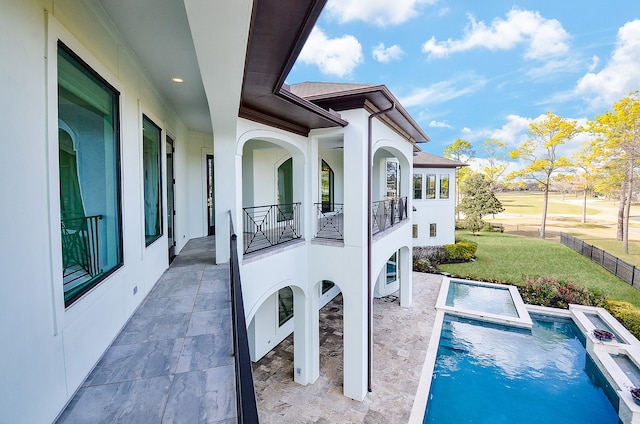 exterior space featuring a lawn and a patio area