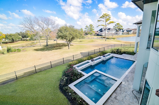 view of swimming pool featuring a yard