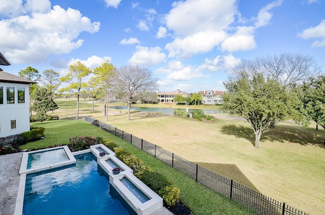 view of swimming pool featuring a yard