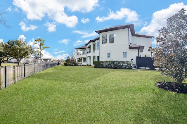 rear view of house with a yard