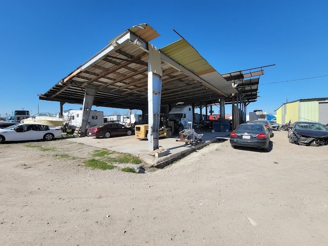 view of parking / parking lot with a carport