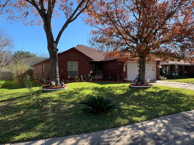 ranch-style house featuring a front yard and a garage