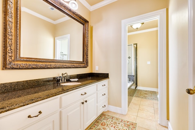 bathroom featuring tile floors, vanity, and crown molding