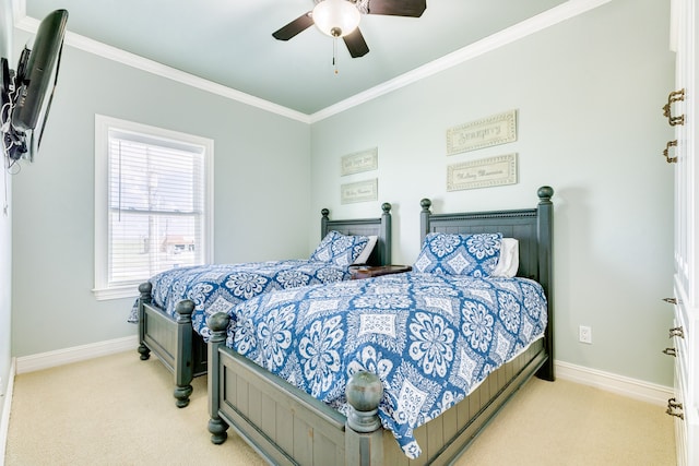 bedroom with ceiling fan, ornamental molding, and light colored carpet