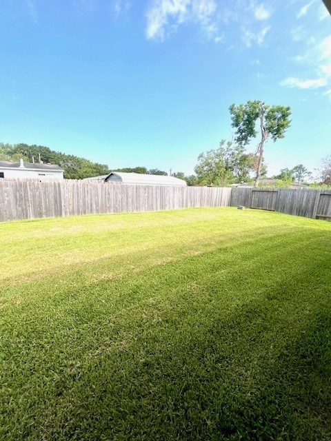 view of yard featuring a fenced backyard