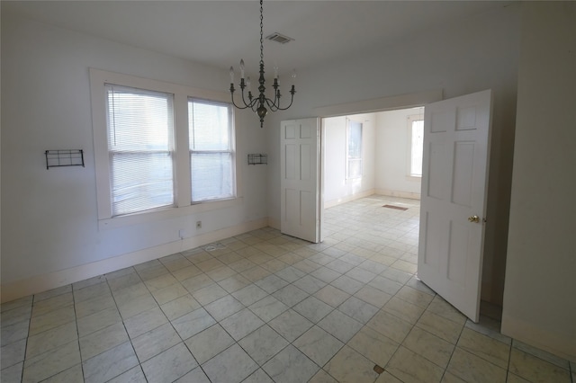 unfurnished dining area featuring light tile patterned floors and an inviting chandelier