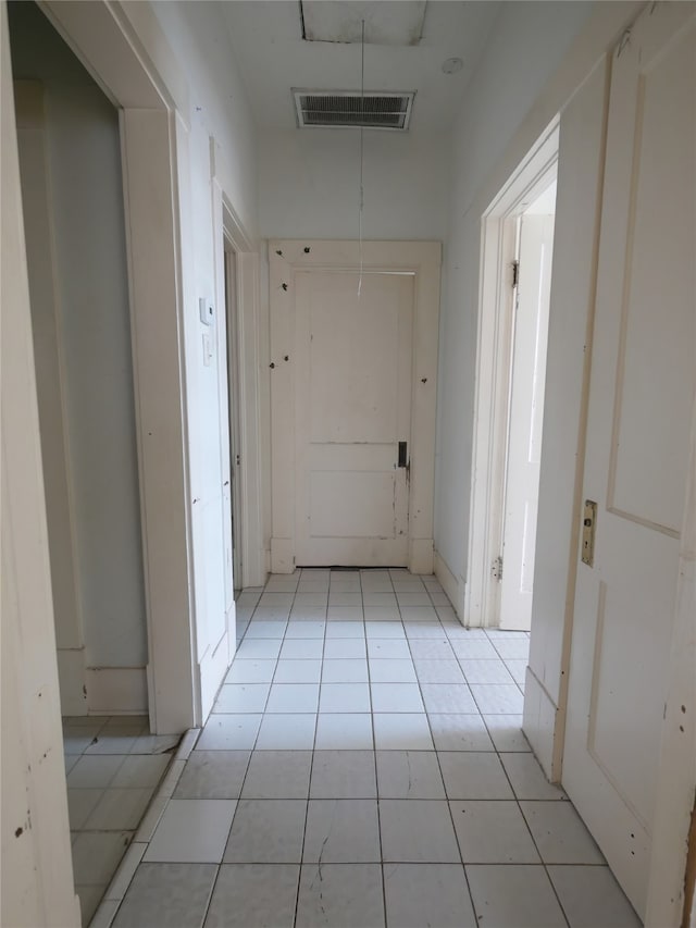 corridor with light tile patterned floors