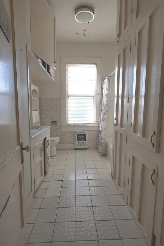 full bathroom featuring vanity, toilet, shower / bath combination with curtain, and tile patterned flooring