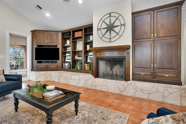 living room featuring light tile patterned floors and lofted ceiling