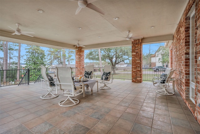 view of patio / terrace featuring ceiling fan