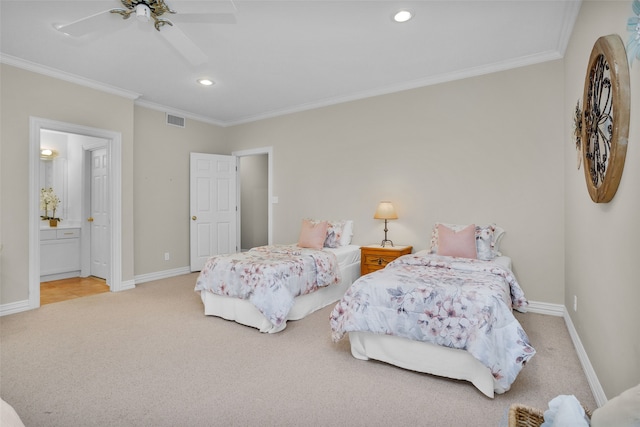 bedroom featuring ensuite bathroom, ceiling fan, light carpet, and crown molding