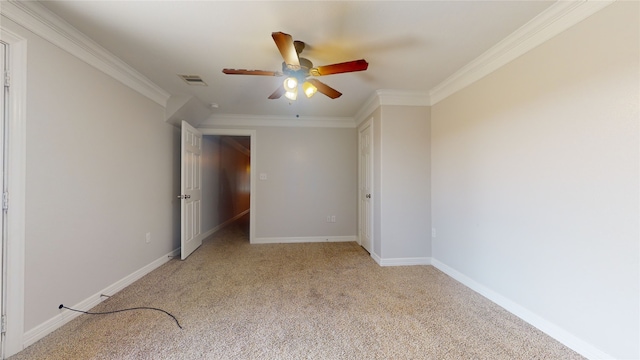 unfurnished bedroom featuring light carpet, crown molding, and ceiling fan