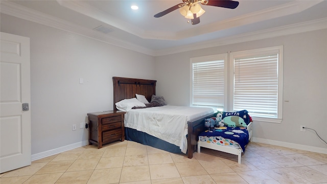 tiled bedroom with a tray ceiling, ceiling fan, and crown molding